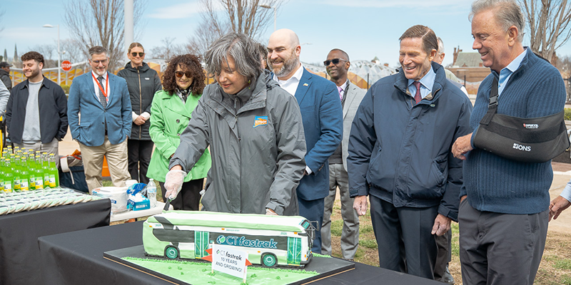 CTDOT's Transit Administrator Lisa Rivers cuts the ceremonial cake alongside Governor Ned Lamont, Senator Richard Blumenthal, and Commissioner Garrett Eucalitto at the CTfastrak anniversary celebration.