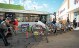 Toys for Tots 2024 Organizers bring shopping carts full of toys to a CTfastrak bus as donations.