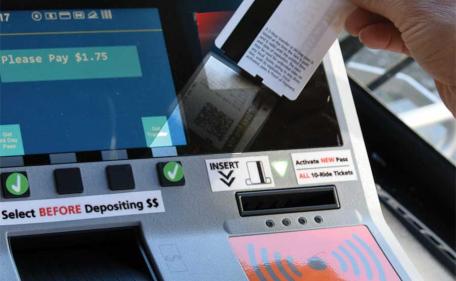 Scan the bar code on the window with the red light on the fare box. Scan the bar code on the window with the red light on the fare box.
